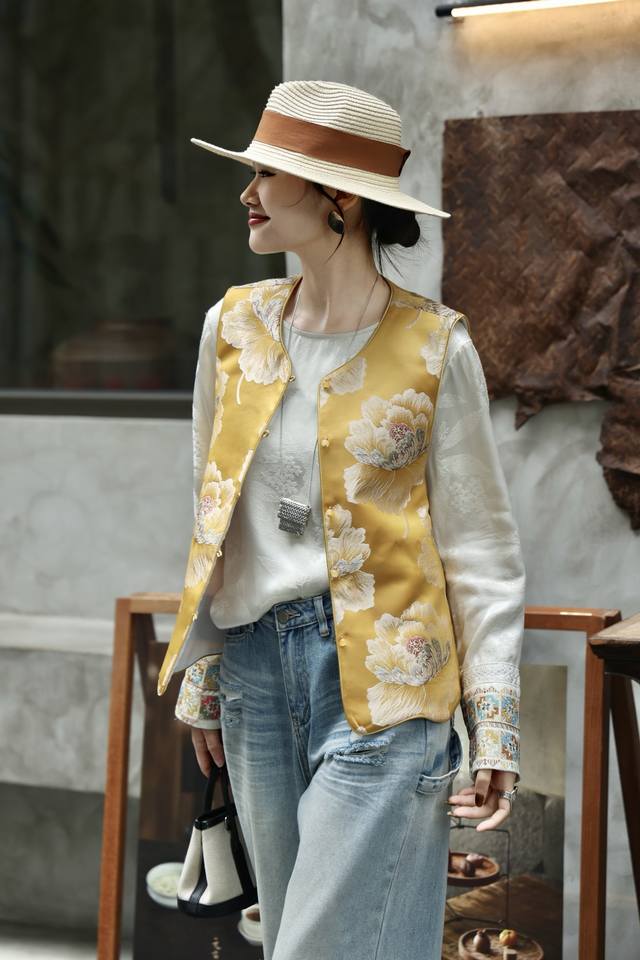 Jacket This reversible vest features a layered peony jacquard weave, recreating