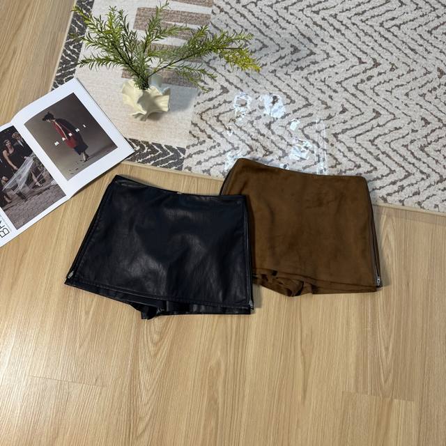 A unique 2025 Fall/Winter midi skirt with double-sided zippers and protein leath