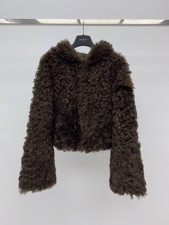 Hooded Shearling Coat Made with premium imported Tuscan shearling fabric. The fu Hooded Shearling Coat Made with premium imported Tuscan shearling fabric. The fu