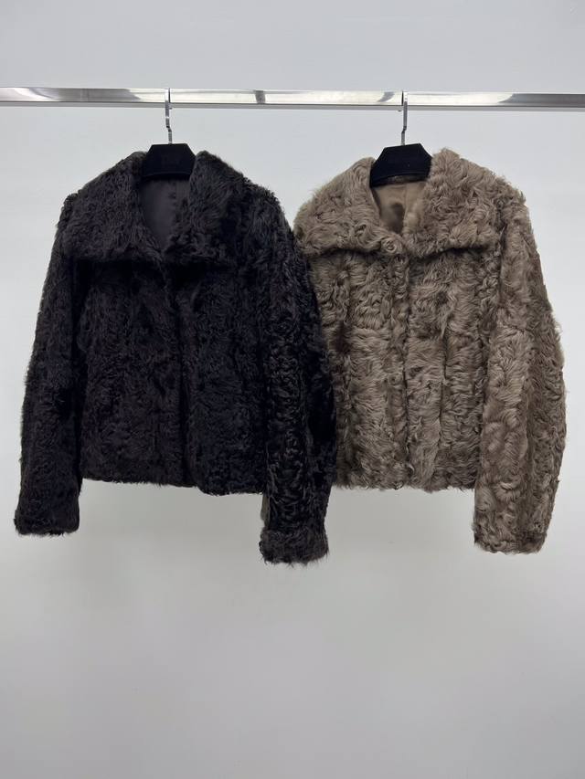 Shearling Coat with Lapel Collar. Made from imported Tuscan shearling, this coat Shearling Coat with Lapel Collar. Made from imported Tuscan shearling, this coat