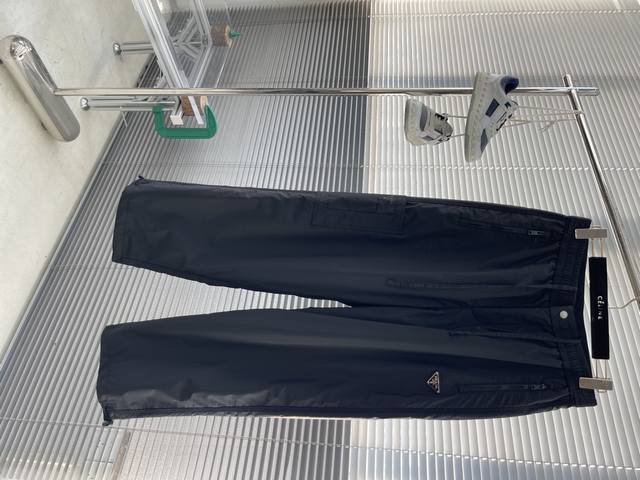 Prad 2025 Autumn/Winter New Casual Pants. Custom enamel metal triangle logo casu