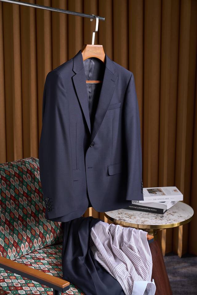 Simple yet sophisticated, exuding elegance. This exquisite two-button, 100% wool