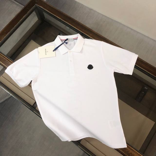 Moncler. New Moncler men's short-sleeved shirt with a unique logo design on the