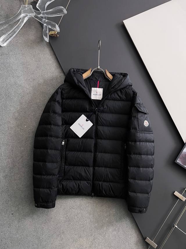 Moncle*25 New Down Jacket: This short down jacket features a soft, wrap-around s