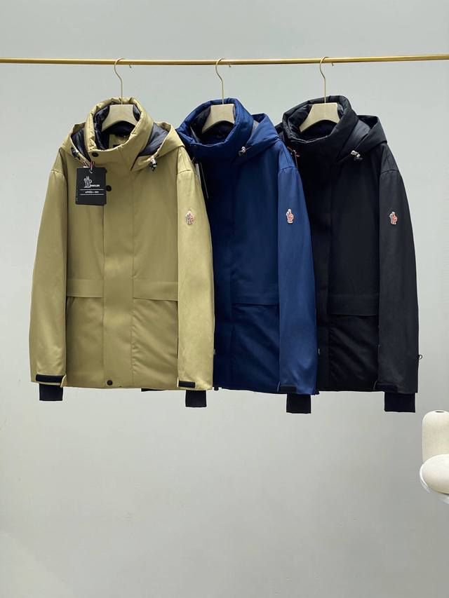 Moncler Hooded Mid-Length Down Jacket. The hooded design provides extra warmth a