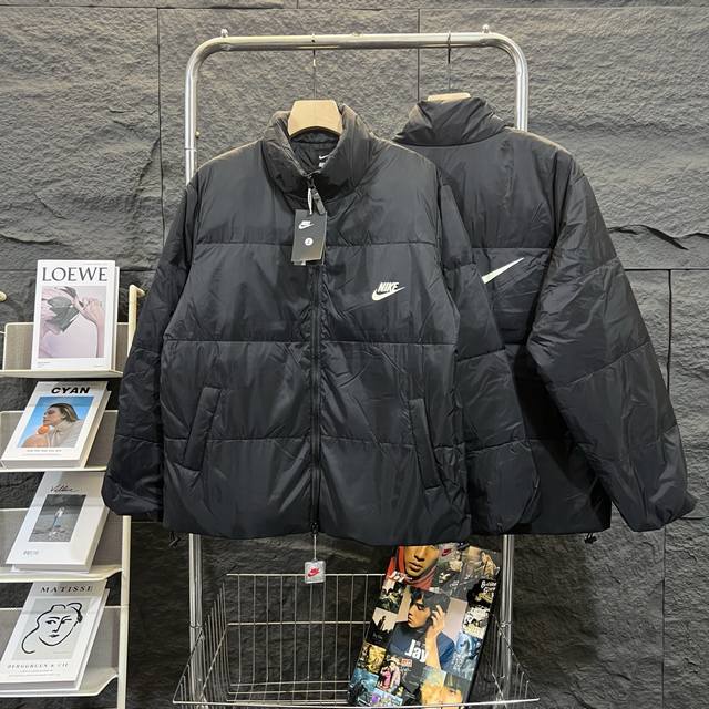 Available for purchase. New Nike down jacket with large swoosh print, couple's