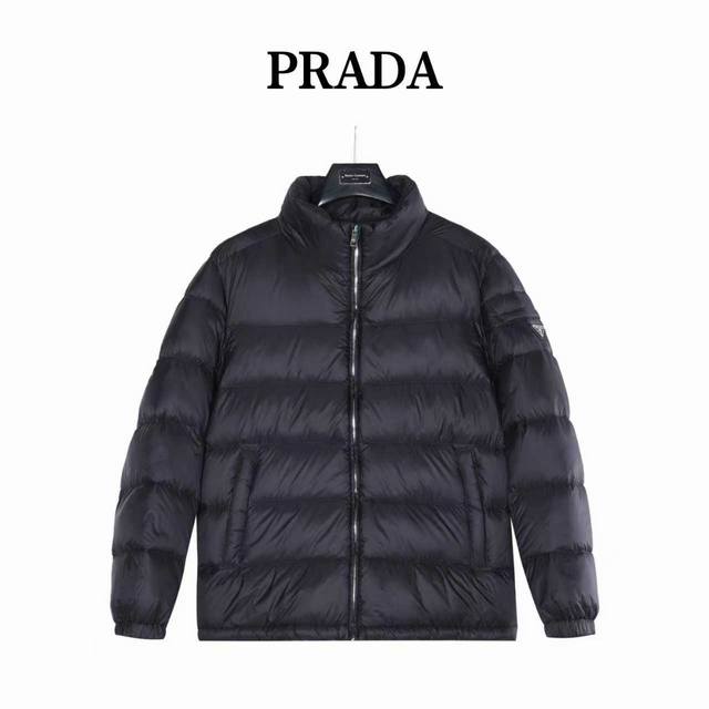 Prada 25Fw down jacket with triangular logo pockets and stand-up collar. Made w