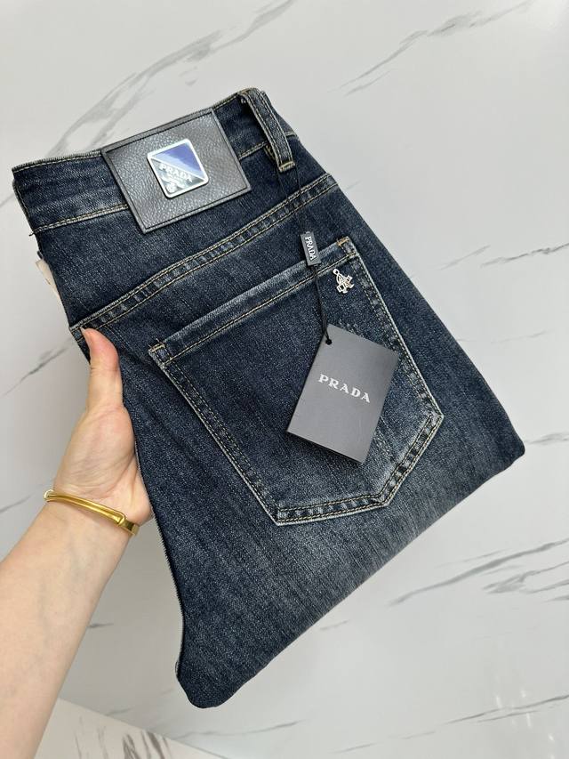 Available simultaneously on the Prada official website and in boutiques. A top-