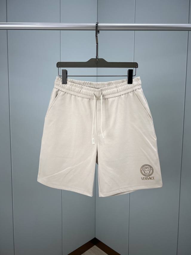 Versace's new summer Medusa logo shorts feature a gold foil print and are made o