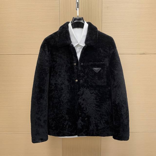 Prada Men's Shearling Coat. Made of sheepskin and lamb's wool, this Prada men's