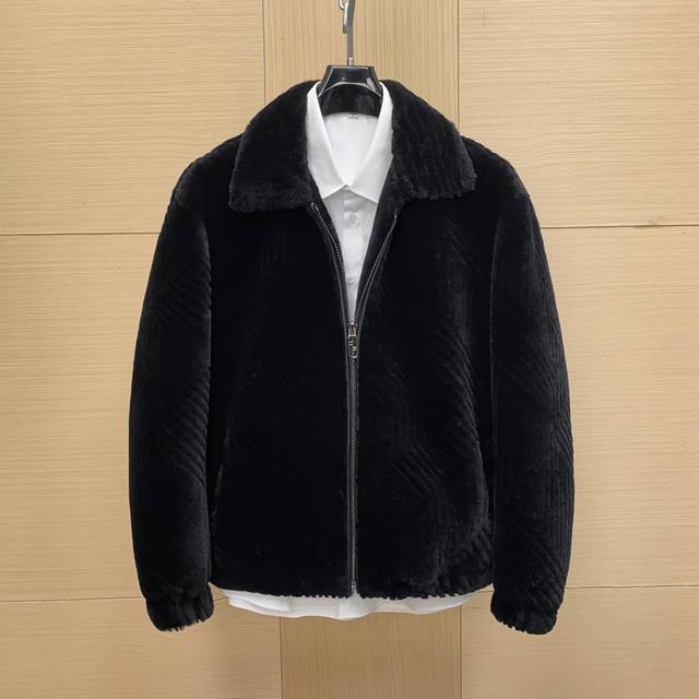 In Stock! This Fendi shearling jacket features natural shearling material and a