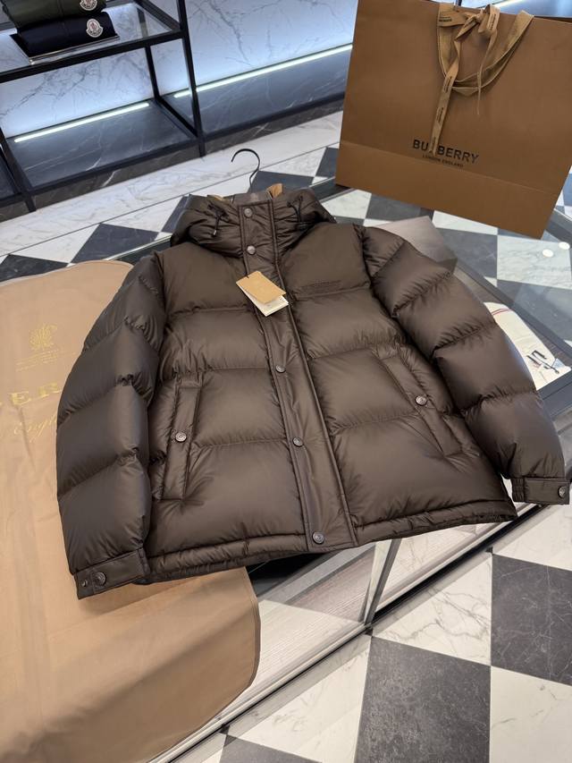 Burberry color-blocked hooded down jacket with logo and lettering. More detailed