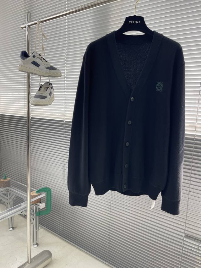 Loew logo embroidered details, fine wool knit cardigan. Medium thickness, feels