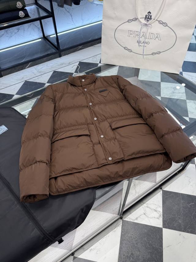 Prada Re-Nylon snap-button down jacket. Filled with goose down. More detailed p