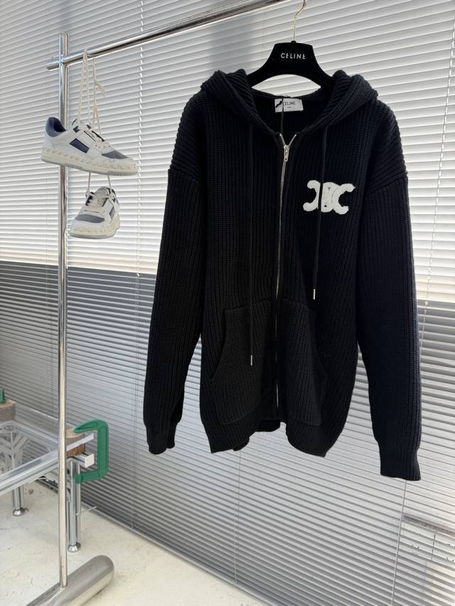 Celin Embroidered Logo Knit Hoodie (DDD) is woven from 55% Merino wool yarn and