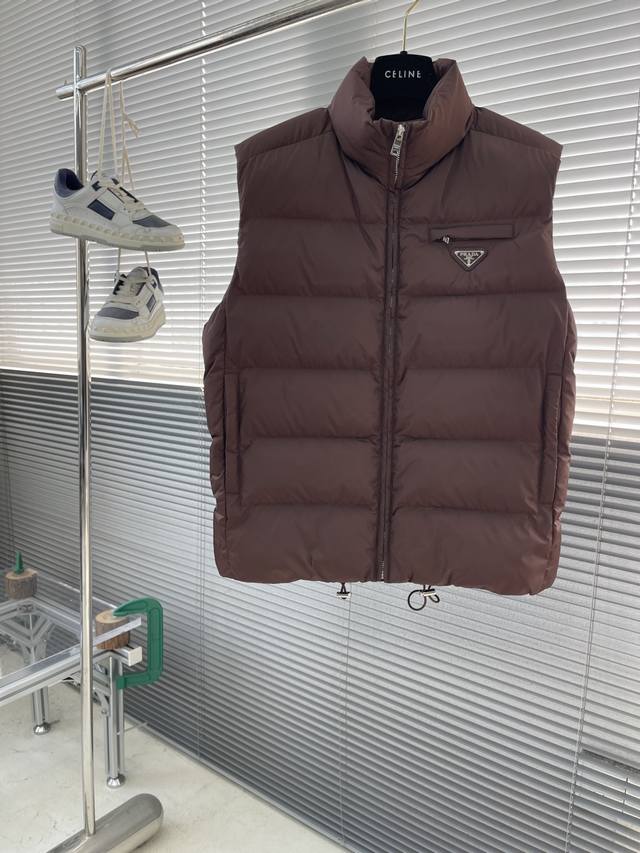 prad 25Fw New Quilted Triangle Logo Vest. This Re-Nylon vest features classic li