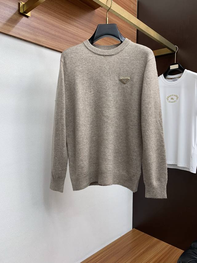 Prada Crew Neck Wool Sweater, woven with delicate fibers, exudes timeless elega