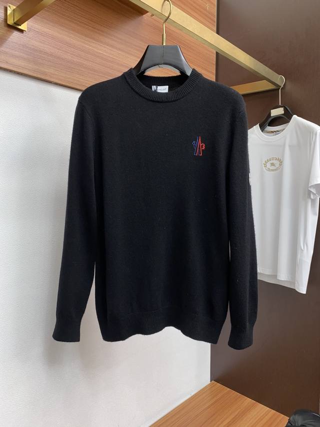 Moncler Crew Neck Wool Sweater, woven with delicate fibers, exudes timeless ele