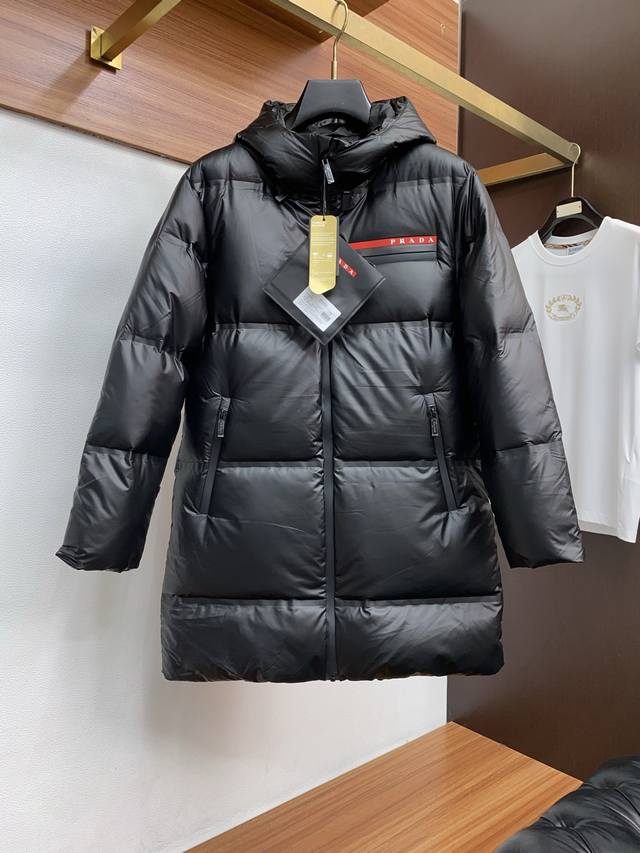Prada's latest Fall/Winter original down jacket DDD. Filled with 90% white duck