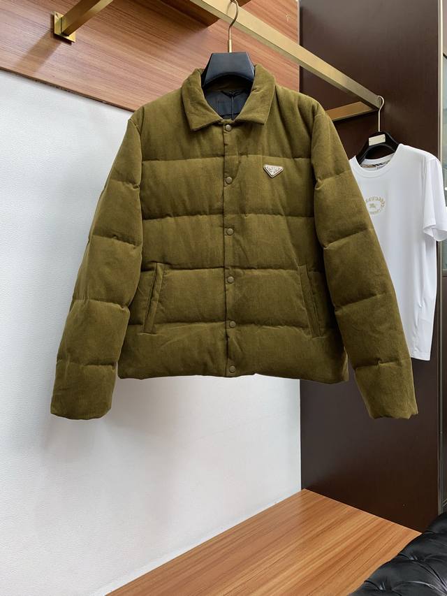 Prada Lapel Down Jacket 25Fw. This jacket features a genuine leather triangle l