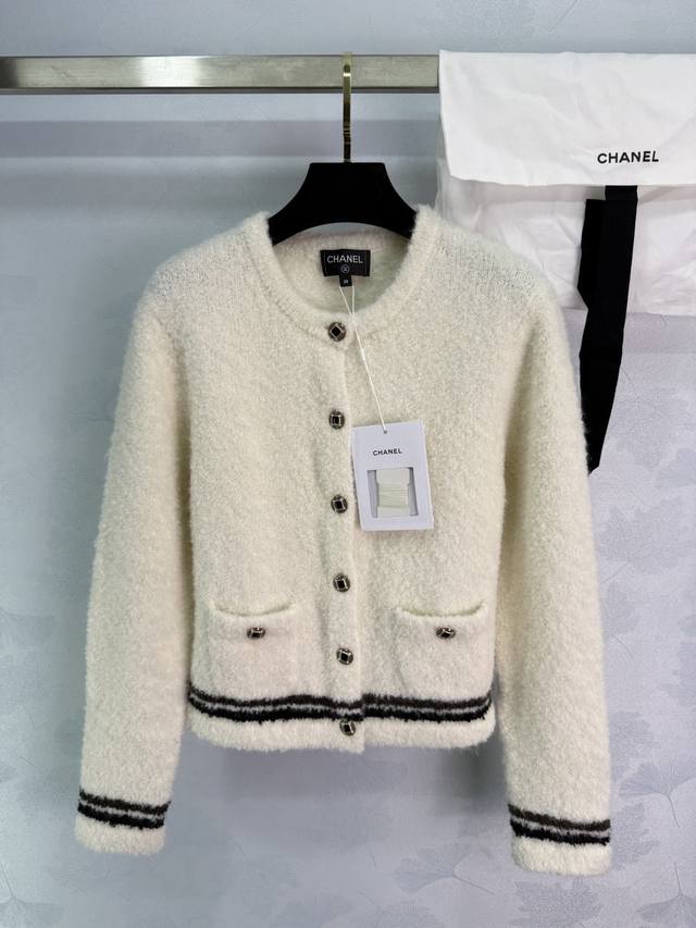 Ch*25N Ski Series White Knit Cardigan. Classic white with brown-trimmed stripes,