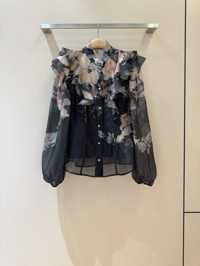 Z*I*M*M New Arrival Recommendation: A black floral print blouse with ruffled sho