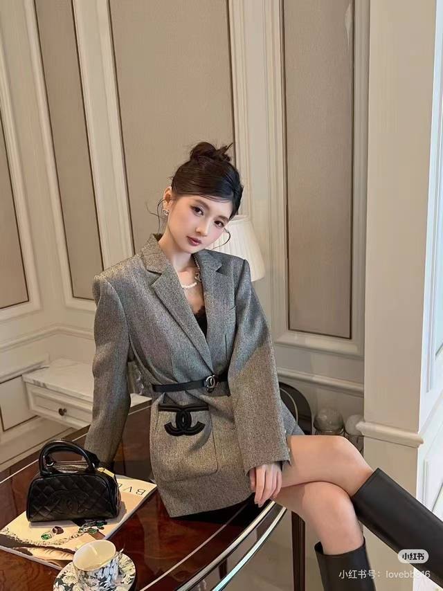 High-end vintage tweed suit jacket, embodying the elegant ambition of a French