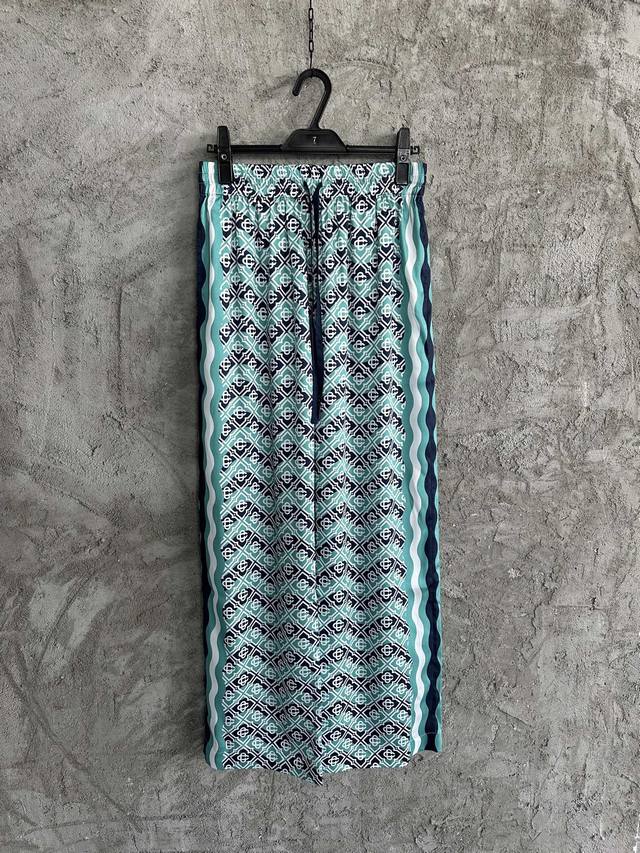 Ca2025Ss Custom-made silk trousers with all-over logo printing. Made with import