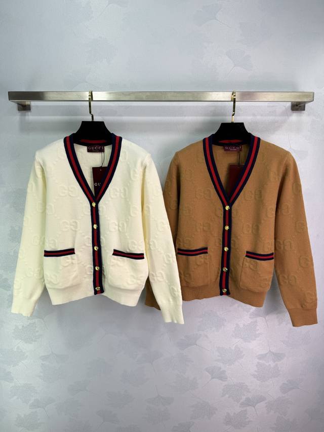 Gucc* This Gg jacquard knit cardigan features an off-white body with contrasting