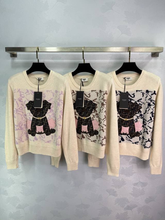 Fend* This puppy print sweater is made of soft knit material. The off-white colo