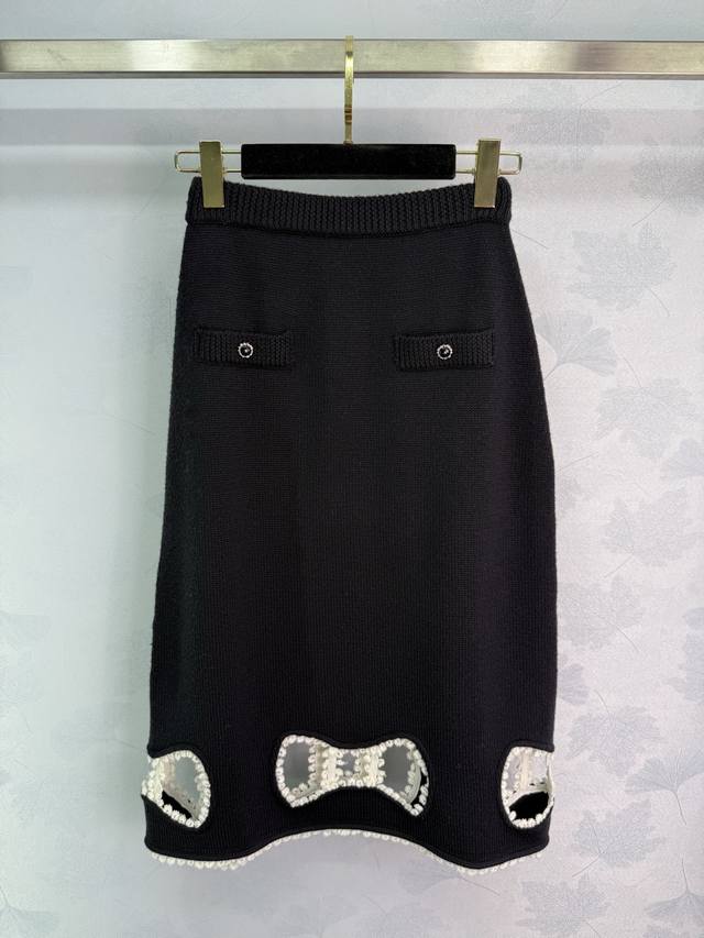 Ch*25 Early Autumn New Arrival Black Bow Knit Midi Skirt. The skirt features a h