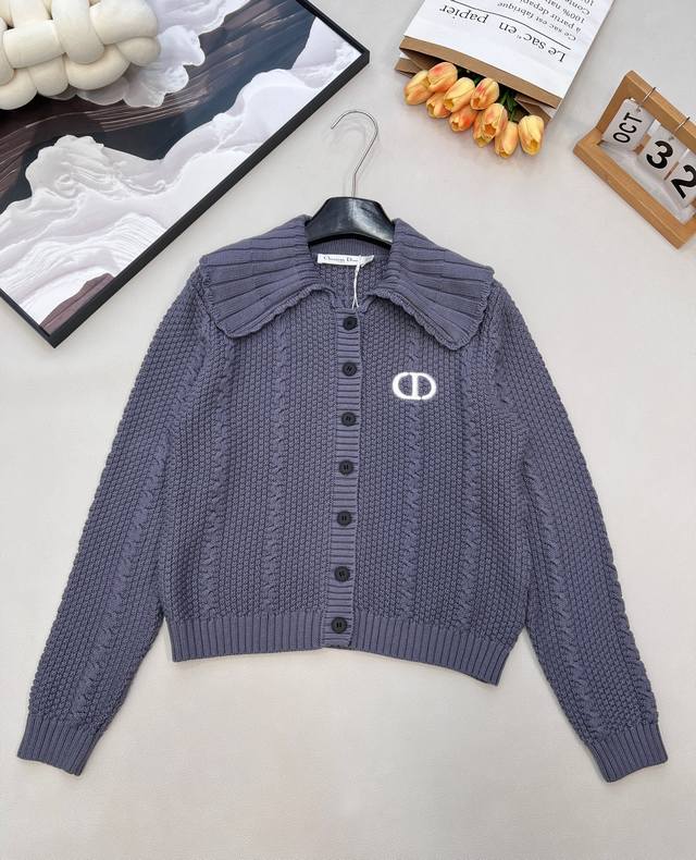 Dior's new letter-embroidered knit cardigan with a turn-down collar has become