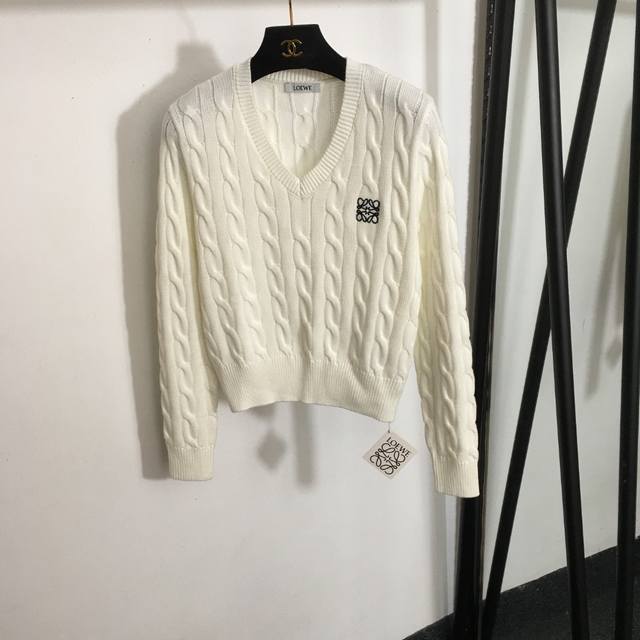 Style No. 4957 Loew* New V-neck cable knit sweater with embroidered logo on the