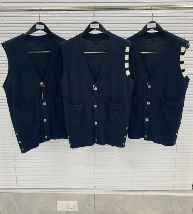 Cashmere Vest (TB) A versatile piece that pairs well with cardigans, crew neck