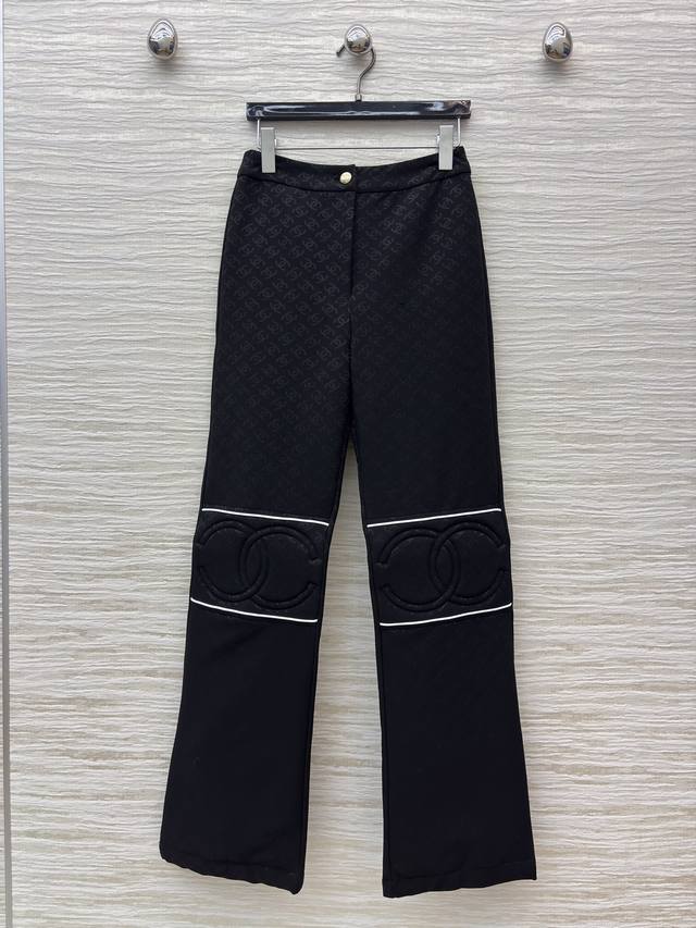 Chanel black flared pants with an all-over subtle double C print, understated y