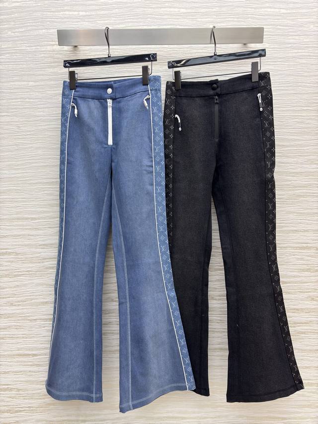 L's side monogrammed flared pants, black with subtle patterns for a cool and sty