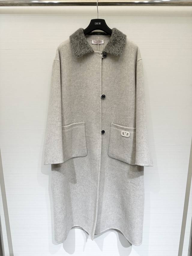 Valentino Fall/Winter 2025 runway collection wool coat with a shearling collar.