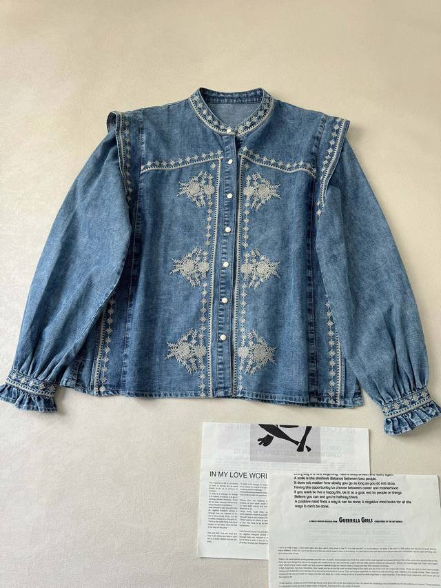 Maiso* Hotel, Spain - Embroidered floral blue denim shirt. The faux two-piece ve