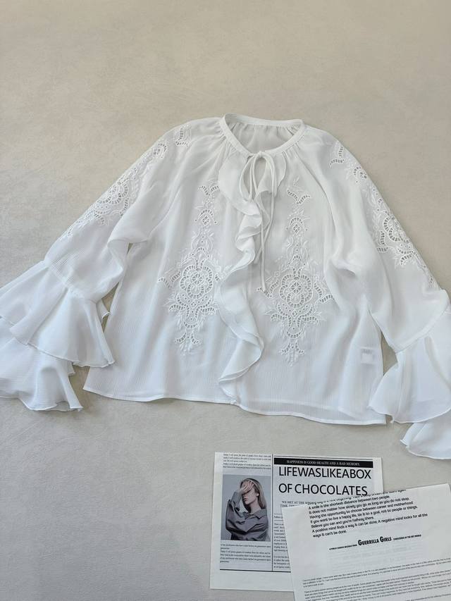 Medina's style ruffled tie-front openwork crepe embroidered top... Features a t