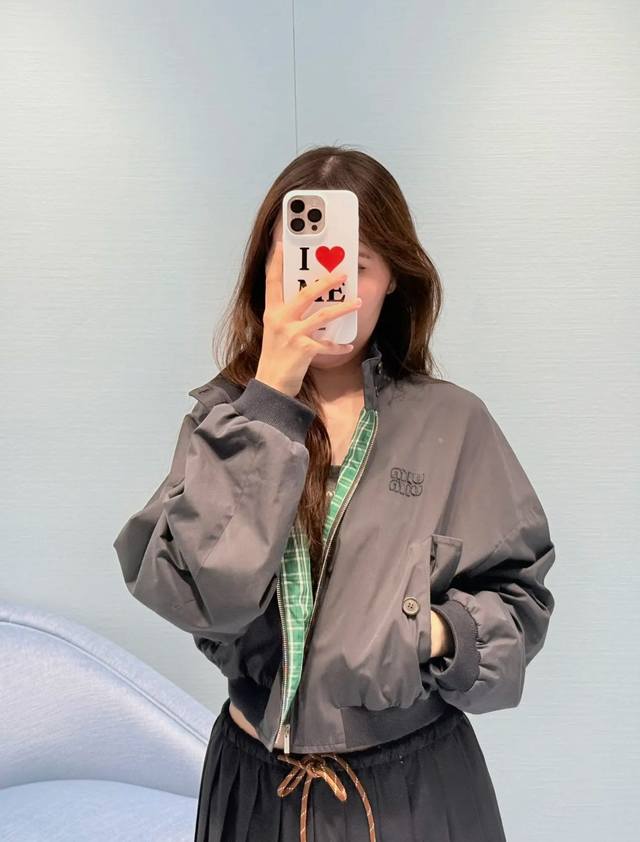 Mi* jacket showcases a style that blends comfort and elegance with its short, wo