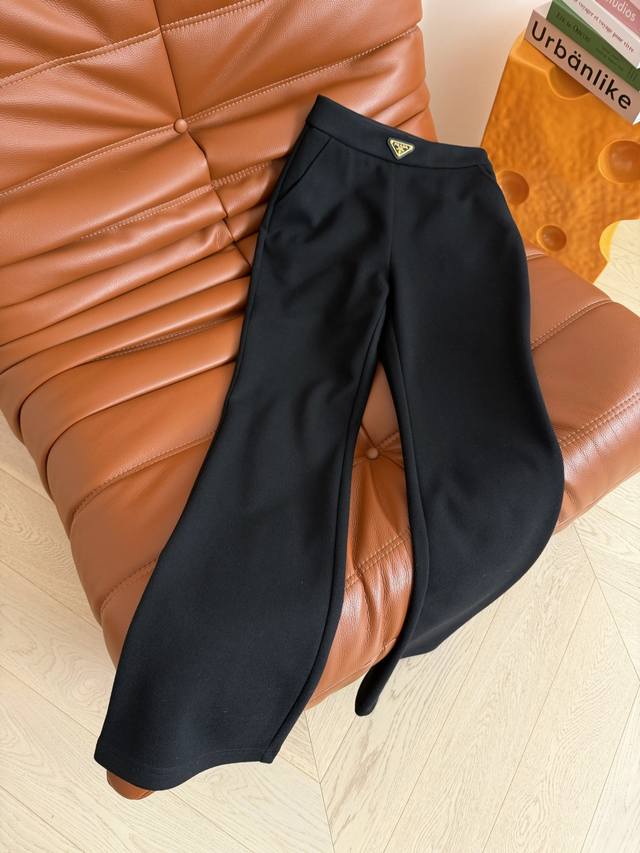 Winter Flared Pants 25Fw Black Thick Flared Pants with Triangle Logo Decoration.