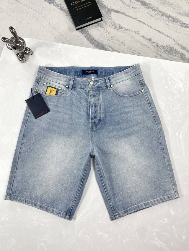 High-quality Louis Vuitton washed denim shorts with visible stitching and pearl