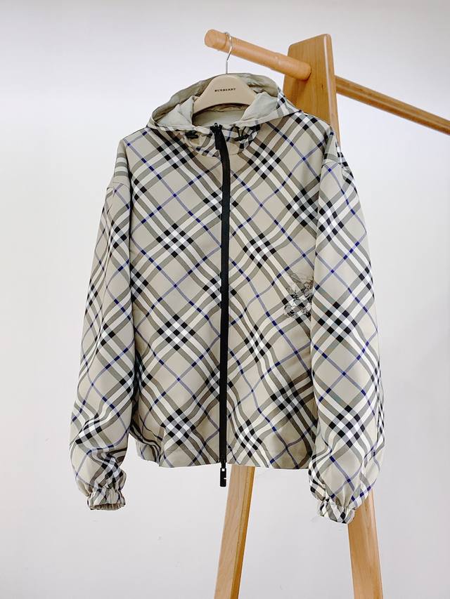 Burberry Reversible Check Embossed Equestrian Logo Jacket. Made of check twill f