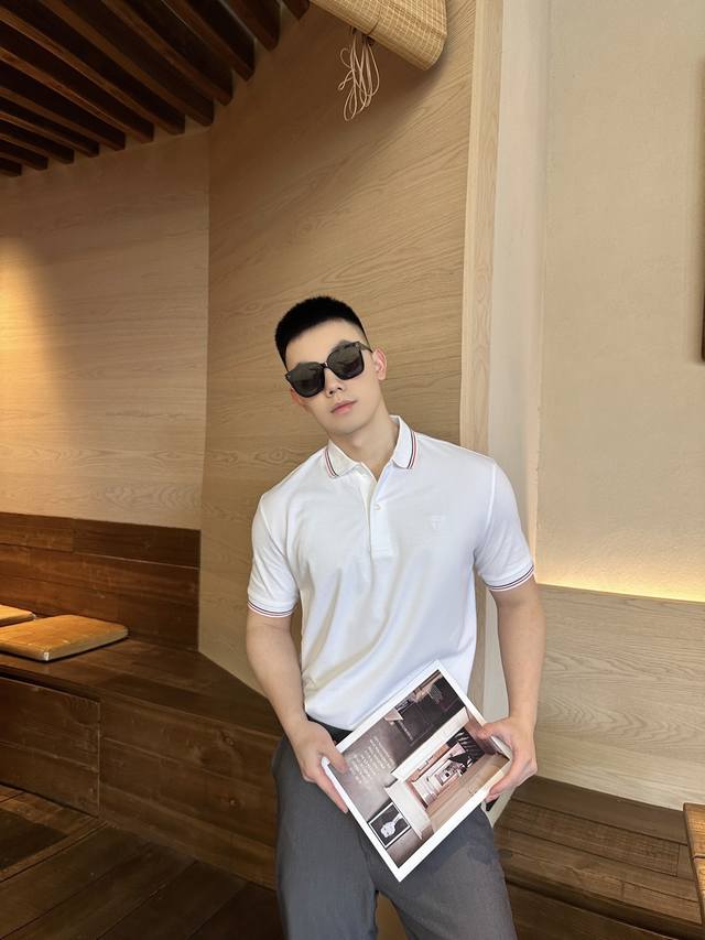 Prada Embroidered Logo Polo Shirt. Custom-made with a breathable, cool, and com