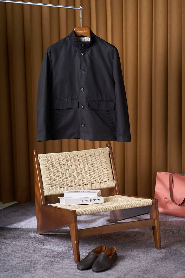 Stand-up Collar Toggle Jacket: A Blend of Retro and Comfort. This jacket feature