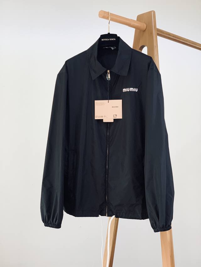 Miumiu logo nylon jacket. Made of nylon, a lightweight, durable, waterproof, and