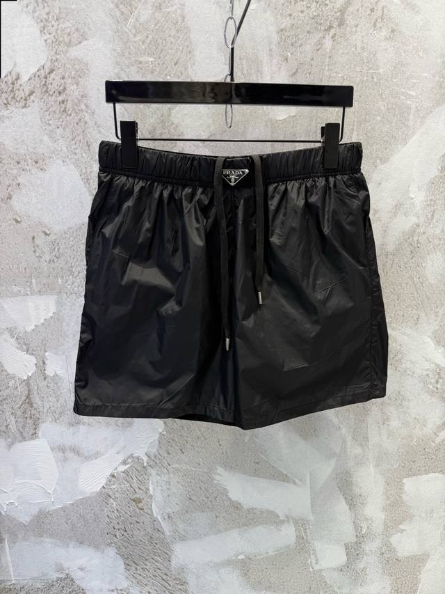 prad Logo Mid-Waist Drawstring Swim Trunks/Shorts These swim trunks feature a st