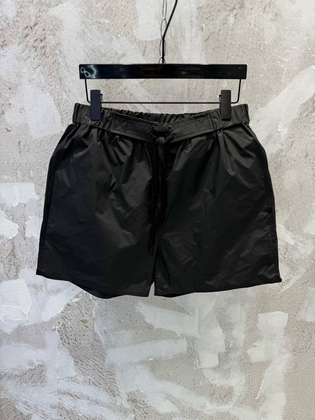 LV 3D Zipper Pocket Beach Shorts Fabric with Subtle Embossed Logo. The pattern i