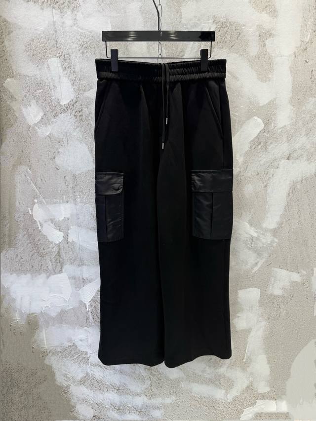 prad Patchwork Nylon Pocket Air Cotton Trousers. The fabric is made of 40-count