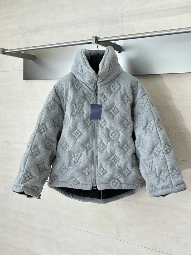 LV Louis Vuitton Monogram Embossed Down Jacket The fabric itself contains a larg